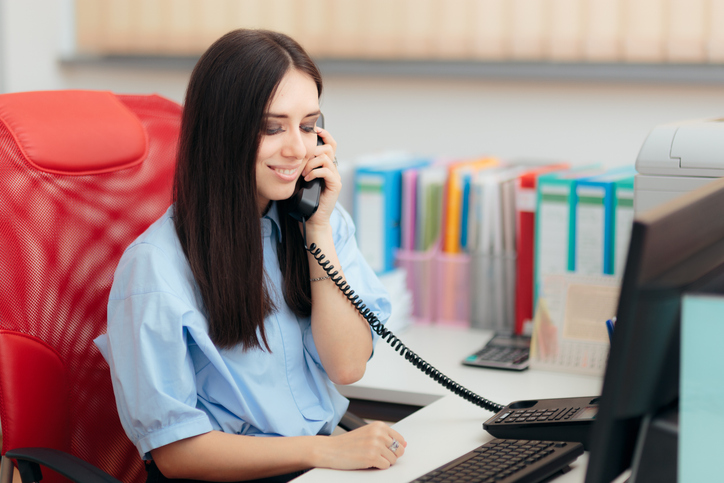 Smiling businessperson on the phone
